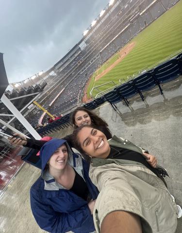 Interns standing in a Stadium.